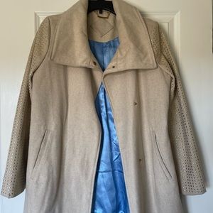 Cream over coat blue  interior with gold accents